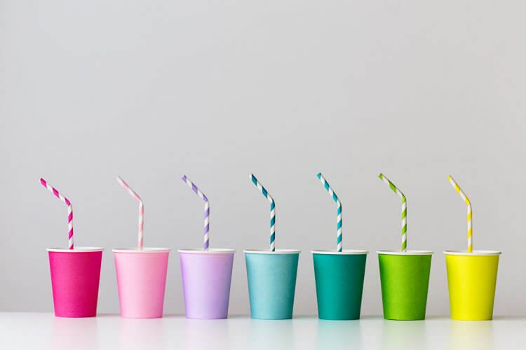 Colorful cups lined at the table
