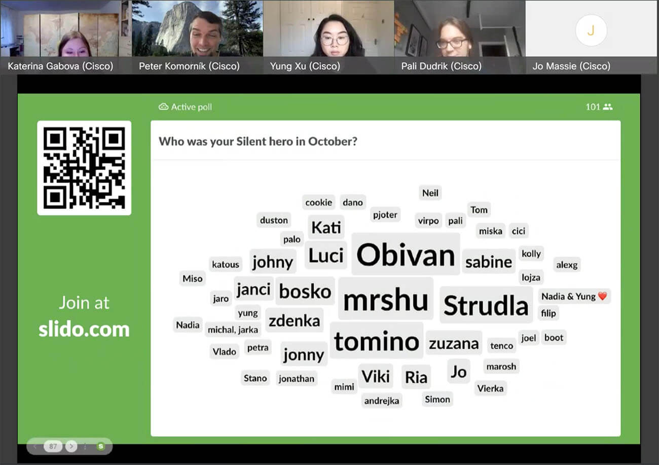 a snapshot from Slido's all hands meetings depicting a Slido word cloud with a silent hero poll being displayed on the screen